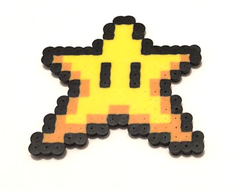 Check out our mario pixel art selection for the very best in unique or custom, handmade pieces from our figurines & knick knacks shops. 8 Bit Mario Star Pixel Art | Sarah Nicole Creations