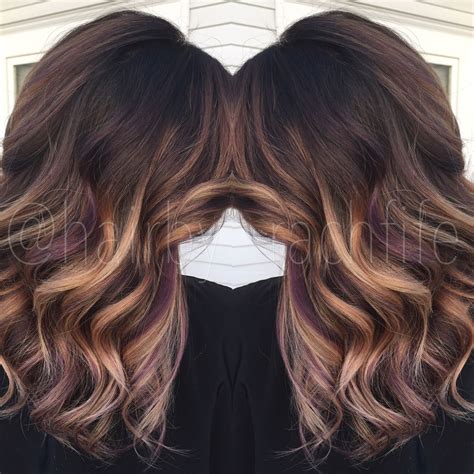 An updated version of a classic style! Colormelt balayage ombre with purple peekaboo highlights ...