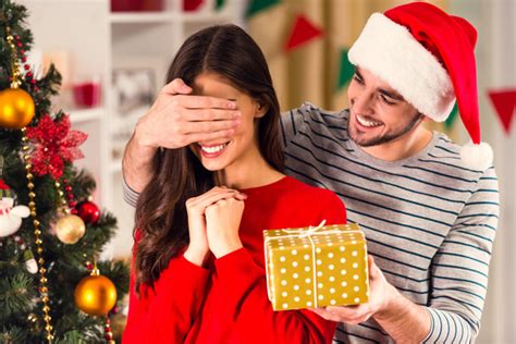 (and, of course, these sweet gifts aren't. Give girlfriend Christmas present Stock Photo - Christmas ...
