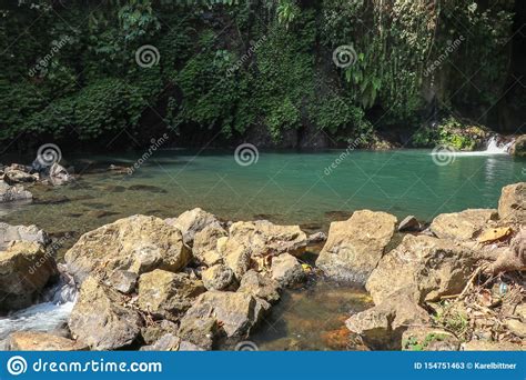 Jungle Landscape With Flowing Turquoise Water Of Blue Lagoon Cascade