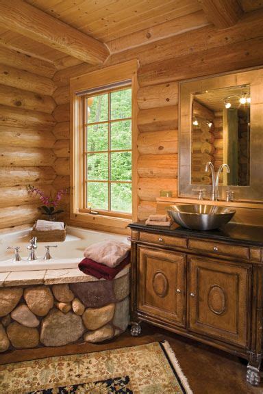 The centerpiece of this master bedroom is the colorado limestone fireplace. Cabin Master Bath (Precision Craft) | Log home bathrooms ...