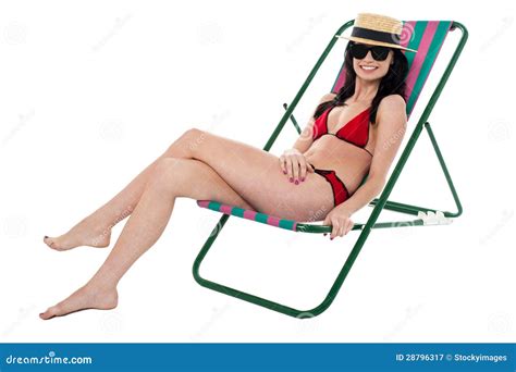 Glamorous Bikini Model Relaxing On Reclining Chair Royalty Free Stock