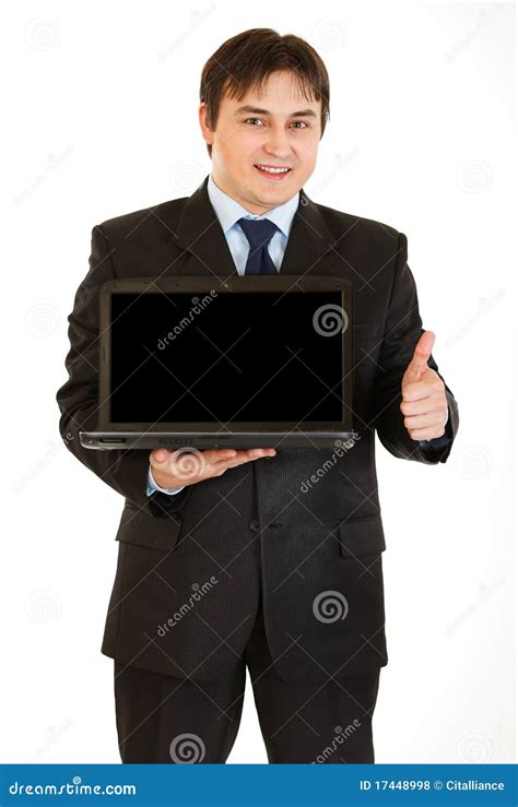 Young Businessman Holding Laptop With Blank Screen Stock Photo Image