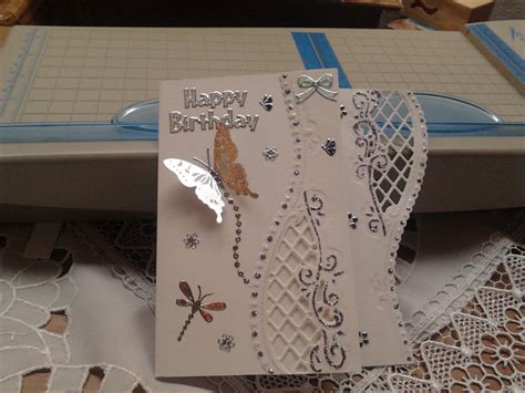 A Close Up Of A Birthday Card On A Table With Doily And Laces