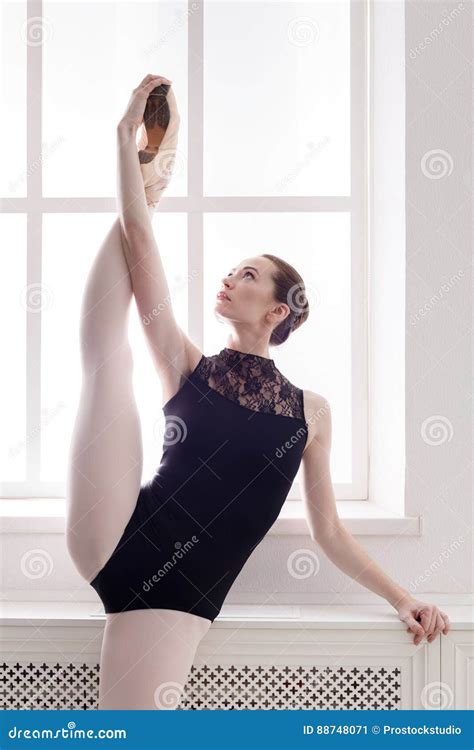 Classical Ballet Dancer In Split Stretching Portrait Stock Image