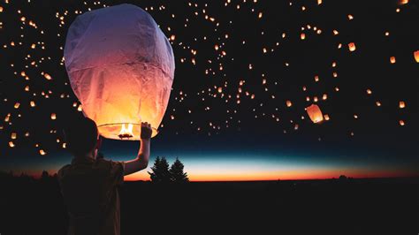 Download Wallpaper Lanterns Floating On The Night Sky 1920x1080