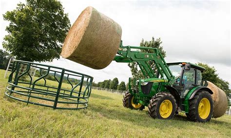 5m Series Tractor With Baler And Loader Lifting Hay Bale Farming