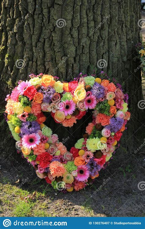 Choose from dozens of floral arrangements for expressing sympathy to the ones you care about. Pastel Sympathy Flowers Near A Tree Stock Image - Image of ...