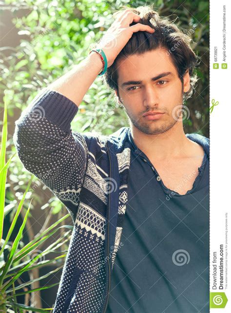 Sensual Handsome Man Model Hairstyle Hand In The Hair Stock Image