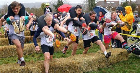 Bizarre Wife Carrying Race In Dorking Will See Winners Take Home A Barrel Of Local Ale Surrey Live