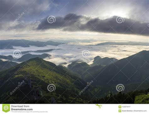 Fantastic View Of Mountain Valley Covered With Low White Puffy L Stock