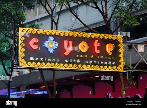The Coyote Bar Advertising Across The Road In Wan Chai Hong Kong Stock