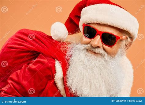 Portrait Of Cool Santa Claus Wearing Trendy Sunglasses Stock Photo