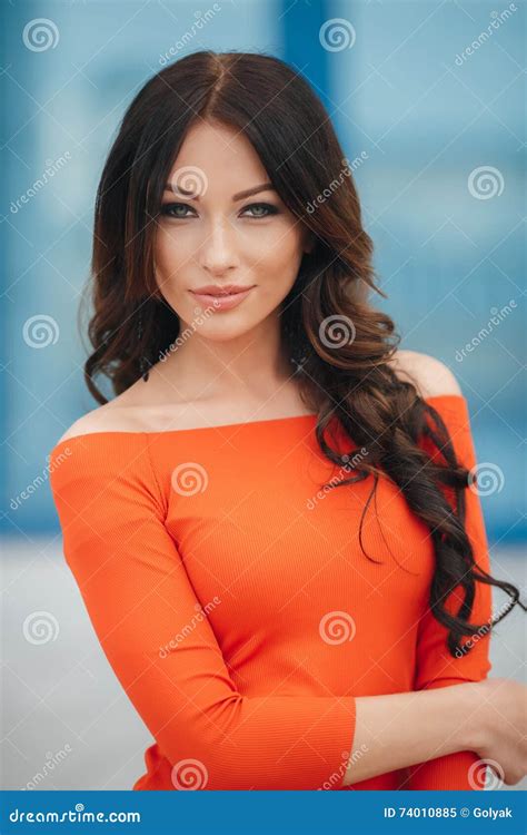 Pretty Woman With Brown Eyes Posing On A Background Of The City Stock