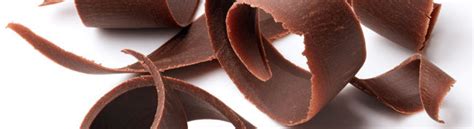 48118679 Group Of Dark Chocolate Shavings Isolated On White
