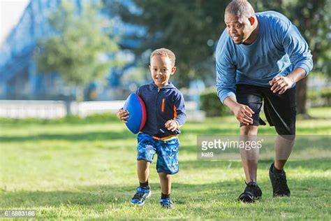 Black Dad Chasing Kids Photos And Premium High Res Pictures Getty Images