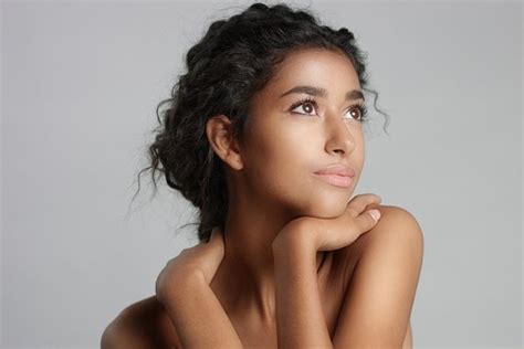 Happy Serene Young Woman With Beautiful Olive Skin And Curly Hair Ideal