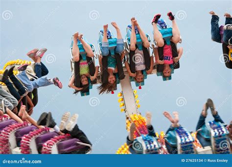 teens go upside down on carnival ride editorial stock image image