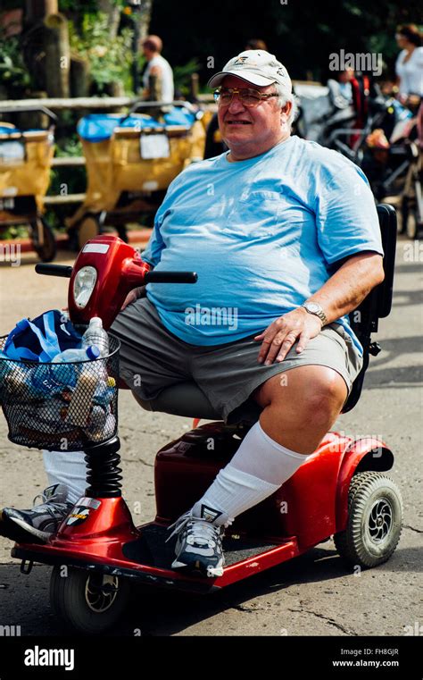 Overweight Person Having Fun At The Amusement Park Of Disney World