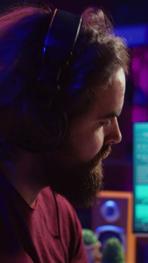 Vertical Video Professional songwriter playing guitar and using