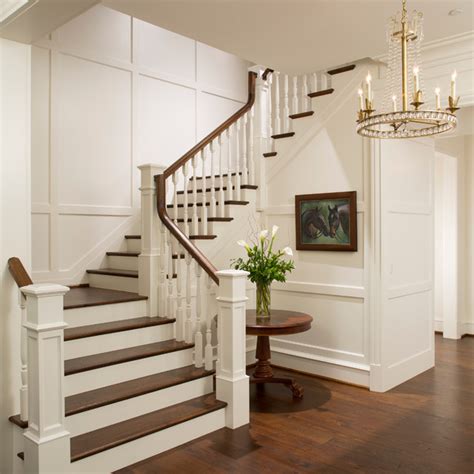 Elegant Foyer Stair Wraps A Paneled Two Story Entry Hall Traditional
