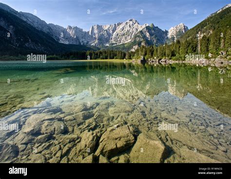 Mangrt Mountain Reflected In Lake At Lagi Di Fusine Julian Alps Italy