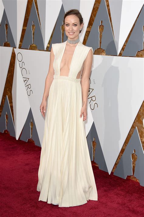 Olivia Wilde At The Oscars Wearing An Ivory Pleated Gown From The Haute
