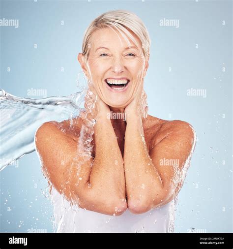 Portrait Senior Woman And Water Splash For Dermatology Cosmetics And Skincare On Grey Studio