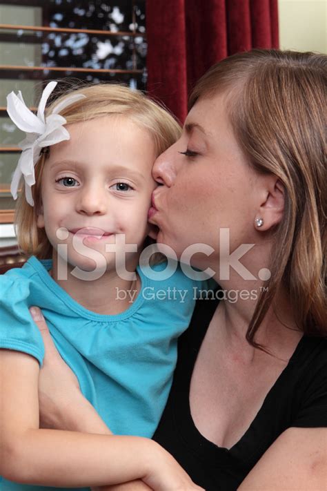Mother Giving Daughter A Kiss Stock Photo Royalty Free Freeimages