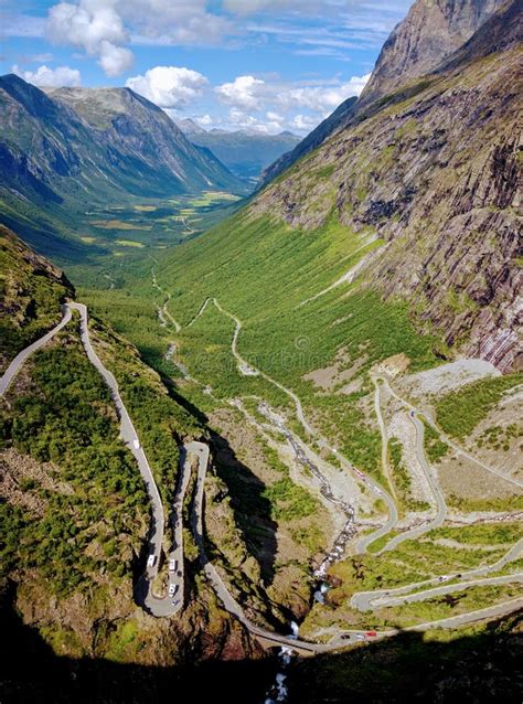 A Serpentine Mountain Road At Trollstigen With The Trollveggen And