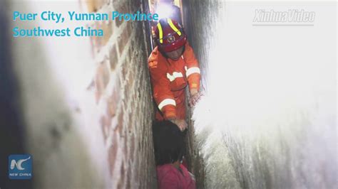 rescued firemen pull out girl stuck in between walls in china youtube