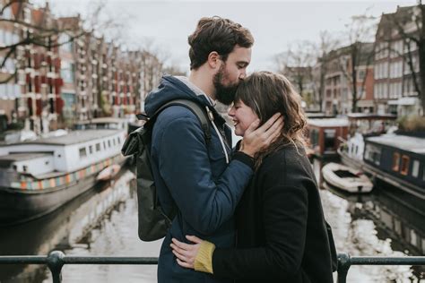 amsterdam engagement photo shoot kiss outfit and location ideas destination wedding