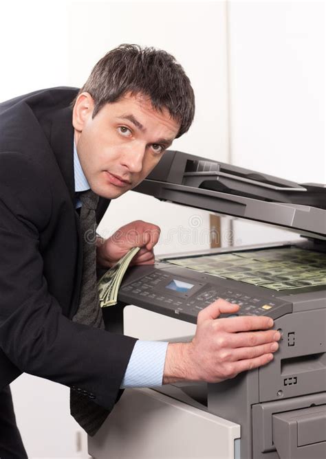 Businessman Make False Money On Copy Machine Royalty Free Stock Photo - Image: 17929045
