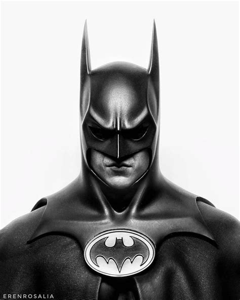 A Black And White Photo Of A Batman In Leather Suit With The Bat Symbol