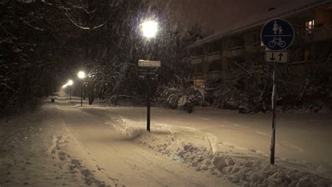 Night Time Snowfall In The Neighborhood Stock Footage