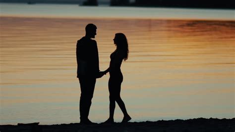 Couple Silhouette At The Beach Sunset Light Stock Footage Video