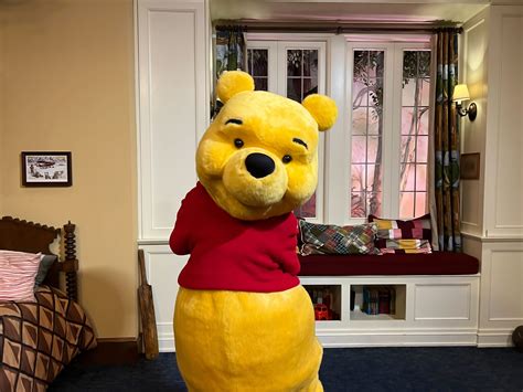 Winnie The Pooh Is Once Again Meeting In Epcot In Christopher Robins