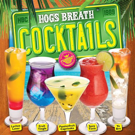 The Hog S Breath Cocktails Poster Is Displayed In Front Of A Wooden Table