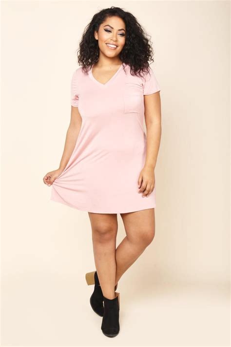 A Plus Size Mini Shift Dress With A V Neckline And Short Sleeves