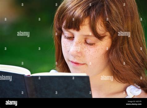 Readyoung Beautiful Girl Reading A Book Outdoor Stock Photo Alamy