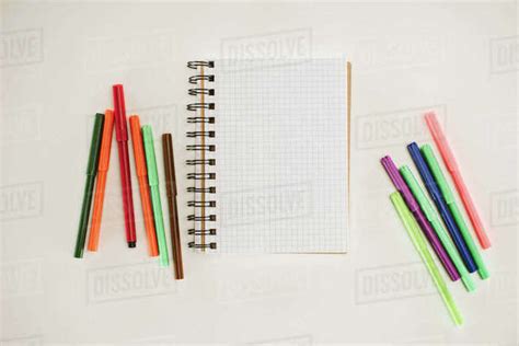 Top View Of Blank Notebook With Colorful Markers Isolated On White