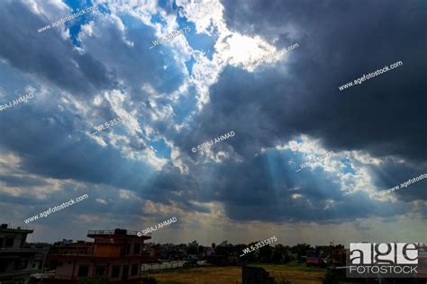 Heavenly Sun Rays Through Dark Clouds Against The Blue Sky Selective
