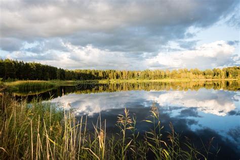 Beautiful Summer Sunset At The Lake With Blue Sky Red And Orange