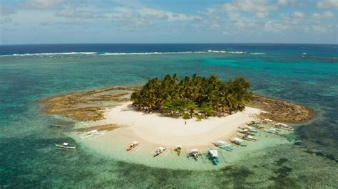 Premium Photo Travel Concept Sandy Beach On A Small Island By Coral