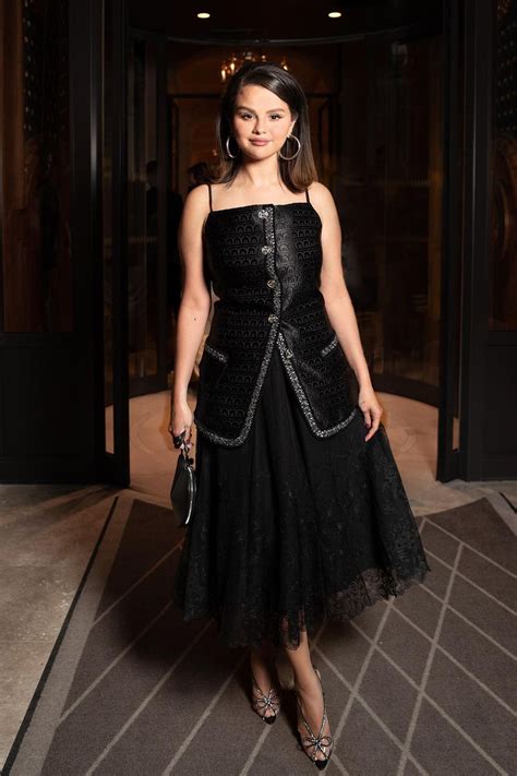 Selena Gomez looks stunning in a black dress while arriving at Hôtel de