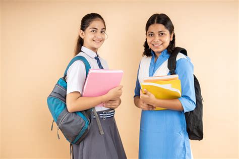 Happy Rural And Modern Indian Student Schoolgirls Wearing School