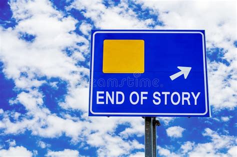 End Of Story Blue Road Sign Over Dramatic Cloudy Sky Stock Photo