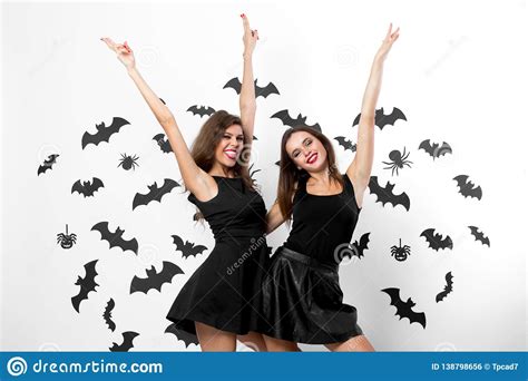 Halloween Party Two Brunette Girls Wearing Black Dresses