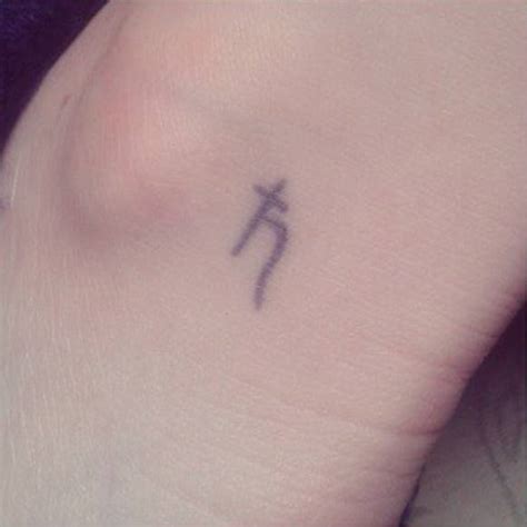 Ankle Tattoo Of The Astrological Symbol Of Saturn