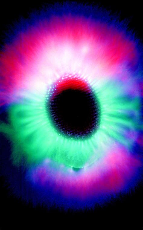 An Eyeball Is Shown In The Dark With Red Green And Blue Colors On It
